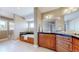 Luxurious bathroom featuring a large tub, shower, and vanity with black countertops at 10950 Elk Horn Run, Littleton, CO 80125