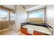 Bright bathroom with a soaking tub and separate shower at 10950 Elk Horn Run, Littleton, CO 80125