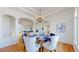 Bright dining room featuring hardwood floors, designer furnishings, and an open floor plan at 10950 Elk Horn Run, Littleton, CO 80125