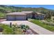 Well-maintained home with a three-car garage, complemented by a manicured lawn and professionally landscaped flower beds at 10950 Elk Horn Run, Littleton, CO 80125