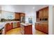 Beautiful kitchen with modern appliances, custom cabinetry, and a large island at 10950 Elk Horn Run, Littleton, CO 80125