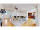 Spacious living room with hardwood floors, modern lighting, and an open floor plan at 10950 Elk Horn Run, Littleton, CO 80125