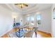 Bright home office with natural light, hardwood floors, and an elegant desk setup at 10950 Elk Horn Run, Littleton, CO 80125