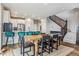 Bright dining area adjacent to the kitchen with a table and seating for six at 6105 N Hanover St, Denver, CO 80238