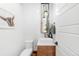 Well-lit half bath with sleek fixtures, floating vanity, and contemporary design at 553 Monroe St, Denver, CO 80206