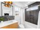 Modern bathroom features stylish tile, a vanity, and a bathtub with a shower at 553 Monroe St, Denver, CO 80206