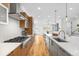 Bright modern kitchen features stainless appliances, granite countertops and gas range at 553 Monroe St, Denver, CO 80206