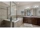 Elegant bathroom with double sinks, soaking tub, and shower at 1488 Madison St # 505, Denver, CO 80206