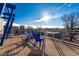 Shared rooftop deck with blue chairs and city views at 1488 Madison St # 505, Denver, CO 80206