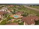 Scenic aerial view highlighting the community pool, playground, and surrounding landscape at 4474 Copeland Cir # 102, Highlands Ranch, CO 80126