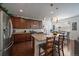Modern kitchen with dark wood cabinets, stainless steel appliances, and granite countertops at 4474 Copeland Cir # 102, Highlands Ranch, CO 80126