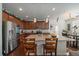 Modern kitchen featuring a center island, breakfast bar, and stainless steel appliances at 4474 Copeland Cir # 102, Highlands Ranch, CO 80126
