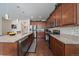 Kitchen with granite countertops, stainless steel appliances and an adjacent eating area at 4474 Copeland Cir # 102, Highlands Ranch, CO 80126