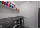 Convenient laundry room featuring modern washer and dryer and neutral paint at 4474 Copeland Cir # 102, Highlands Ranch, CO 80126