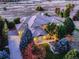 Aerial view of a home with a sprawling roof, manicured landscaping, and a long driveway at 5603 Twilight Way, Parker, CO 80134