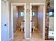 Dual private toilet rooms with their own windows, part of the primary bath suite at 5603 Twilight Way, Parker, CO 80134