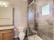 Features include a tiled shower with glass doors, a toilet, and a vanity with a granite countertop at 5603 Twilight Way, Parker, CO 80134