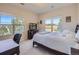 Sunny bedroom with a calming view from large windows, a desk, and nice carpet at 5603 Twilight Way, Parker, CO 80134