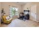 Cozy bedroom with a decorative rug, vibrant curtains and a comfortable yellow chair at 5603 Twilight Way, Parker, CO 80134