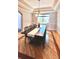 The dining room boasts decorative tray ceilings, an elegant light fixture, and hardwood flooring at 5603 Twilight Way, Parker, CO 80134