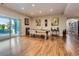 Spacious recreation room with a pool table, hardwood floors, and sliding glass doors to the outdoor patio at 5603 Twilight Way, Parker, CO 80134