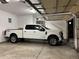 Spacious garage with a white truck, perfect for parking and storage at 5603 Twilight Way, Parker, CO 80134