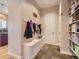 Well-organized mudroom with hooks, storage bench, and shoe racks for a tidy entryway at 5603 Twilight Way, Parker, CO 80134