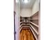 Well-organized walk-in pantry with ample shelving space and hardwood flooring at 5603 Twilight Way, Parker, CO 80134