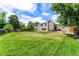 Expansive backyard with lush green lawn, perfect for outdoor activities and relaxation at 17177 E Milan Cir, Aurora, CO 80013