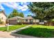 Beautiful ranch-style home featuring a well-maintained front yard and an attached two-car garage at 17177 E Milan Cir, Aurora, CO 80013