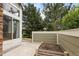 Private back patio with a small garden bed and plenty of space for outdoor seating at 805 Summer Hawk Dr # 100, Longmont, CO 80504