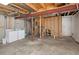 Unfinished basement with exposed beams, laundry hookups, and framing at 805 Summer Hawk Dr # 100, Longmont, CO 80504