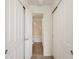 Bathroom view through open sliding closet doors, featuring tile floors and a bathtub at 805 Summer Hawk Dr # 100, Longmont, CO 80504