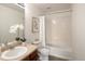 Bright bathroom with vanity, granite countertop, framed art, and a shower with a bathtub at 805 Summer Hawk Dr # 100, Longmont, CO 80504