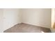 Empty bedroom with neutral carpet and paint, window with curtains, and closet at 805 Summer Hawk Dr # 100, Longmont, CO 80504