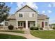 Inviting home featuring a well-maintained lawn, concrete pathway, and cozy entranceways at 805 Summer Hawk Dr # 100, Longmont, CO 80504