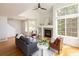 Bright living room with hardwood floors, fireplace, and large windows providing lots of natural light at 805 Summer Hawk Dr # 100, Longmont, CO 80504