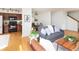 Open-concept living area showcasing hardwood floors and a view to the kitchen and dining space at 805 Summer Hawk Dr # 100, Longmont, CO 80504