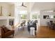 Cozy living room with hardwood floors, a fireplace, and ample natural light at 805 Summer Hawk Dr # 100, Longmont, CO 80504