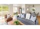 Bright living room with hardwood floors and views of the kitchen and dining area at 805 Summer Hawk Dr # 100, Longmont, CO 80504