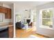 Bright living room with high ceilings, large windows, and a cozy fireplace at 805 Summer Hawk Dr # 100, Longmont, CO 80504