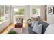 Inviting living room featuring hardwood floors, ample natural light, and access to the outdoors at 805 Summer Hawk Dr # 100, Longmont, CO 80504