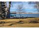 Lakeside park featuring picnic tables, paddleboard rentals, and scenic views of the water at 805 Summer Hawk Dr # 100, Longmont, CO 80504