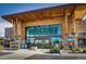 Whole Foods Market entrance shows well-manicured floral displays and lush landscaping for a inviting shopping experience at 805 Summer Hawk Dr # 100, Longmont, CO 80504