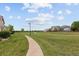 Scenic walking path through a lush green park on a bright, sunny day at 805 Summer Hawk Dr # 100, Longmont, CO 80504
