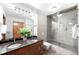 Modern bathroom with double vanity and glass shower at 100 Park W Ave # 2008, Denver, CO 80205