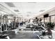 Well-lit gym with various exercise equipment and large windows at 100 Park W Ave # 2008, Denver, CO 80205