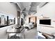 Modern living area with dining, sleeping and media, all with bright cityscape views at 100 Park W Ave # 2008, Denver, CO 80205
