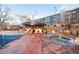 Outdoor community pool area with lounge seating, cabanas, and a relaxing hot tub at 100 Park W Ave # 2008, Denver, CO 80205