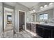 Shared bathroom with double vanity and toilet at 13300 Monaco Ct, Thornton, CO 80602